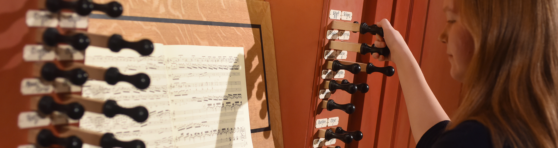 student-playing-organ